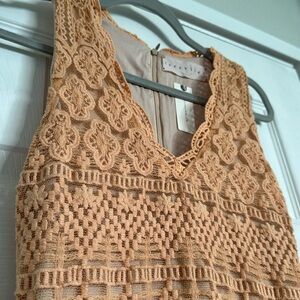 Light tangerine long, woven Korovilas dress.